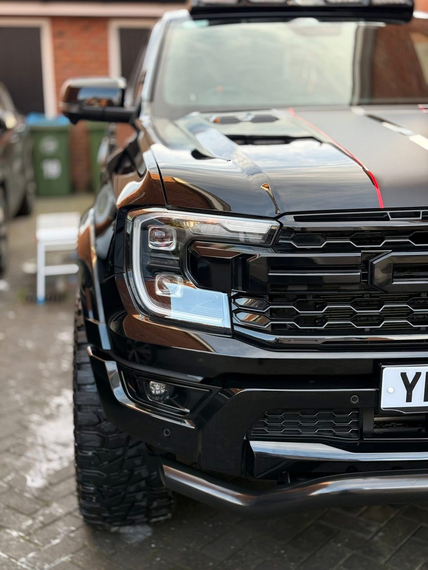 vehicle shown in the supplied headlight restoration photos